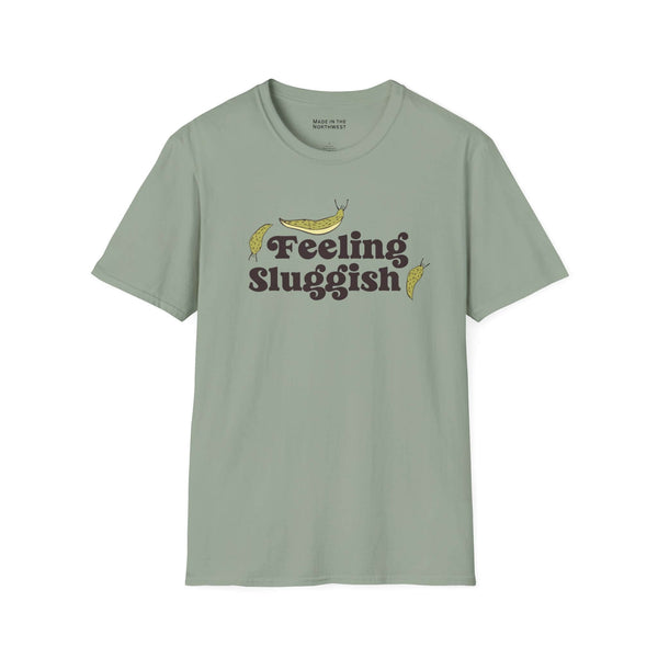 Feeling Sluggish T Shirt featuring playful slug graphics and a humorous text design on a soft green fabric.