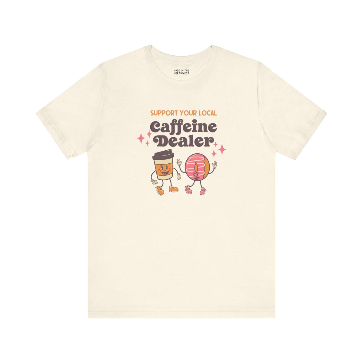Playful Support Your Local Caffeine Dealer coffee soft tee featuring cartoon coffee cup and pastry.