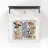 The Crime Scene Snuggle Lightweight Blanket for True Crime Lovers displayed on a bed with bold crime scene designs.