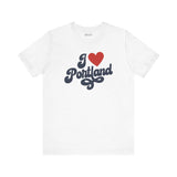 I love Portland t shirt with cursive design on a white background, expressing Oregon hometown pride.
