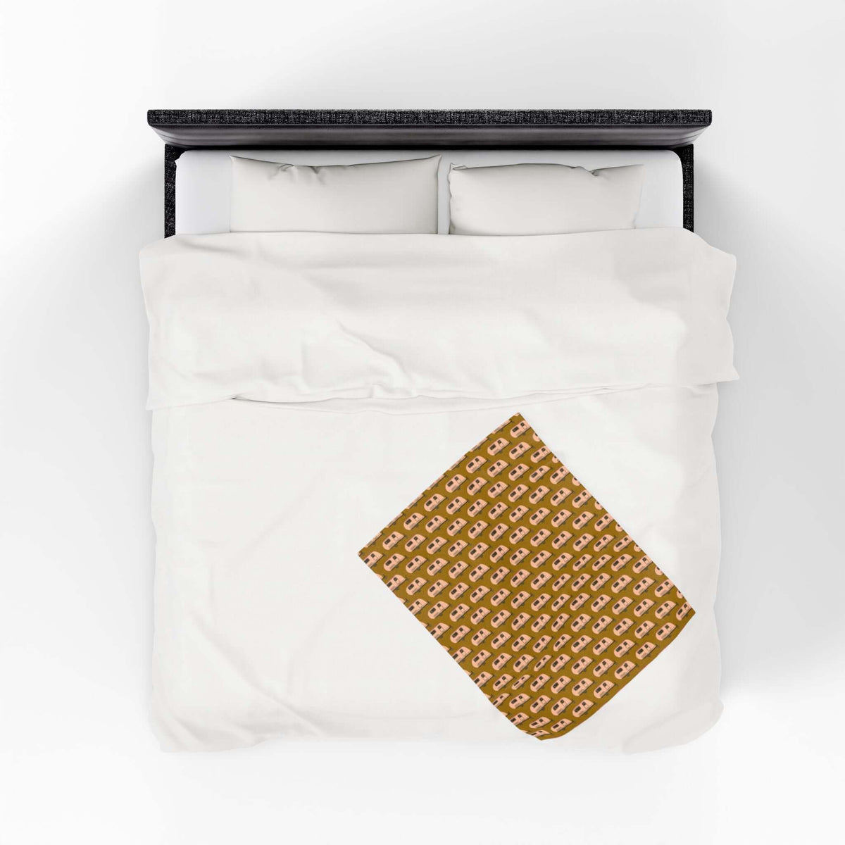 Tiny Trailer Travels RV Lightweight Cozy Blanket spread on a white bed, showcasing a charming travel trailer pattern.