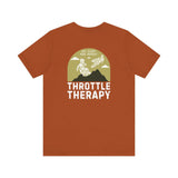 Throttle Therapy soft tee with dirt bikers jumping against mountain backdrop, perfect for motocross enthusiasts, in brown color.