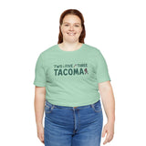 Woman wearing Two Five Three Tacoma soft tee with axe and tree design, celebrating city pride and hometown style.