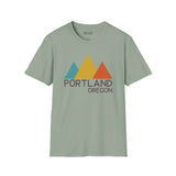 Modern Peaks Portland T Shirt featuring minimalist mountain design with colorful triangles and text.