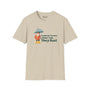 Beige softstyle t-shirt featuring gnome with umbrella and text 'People in Tacoma Don't Tan, They Rust'.