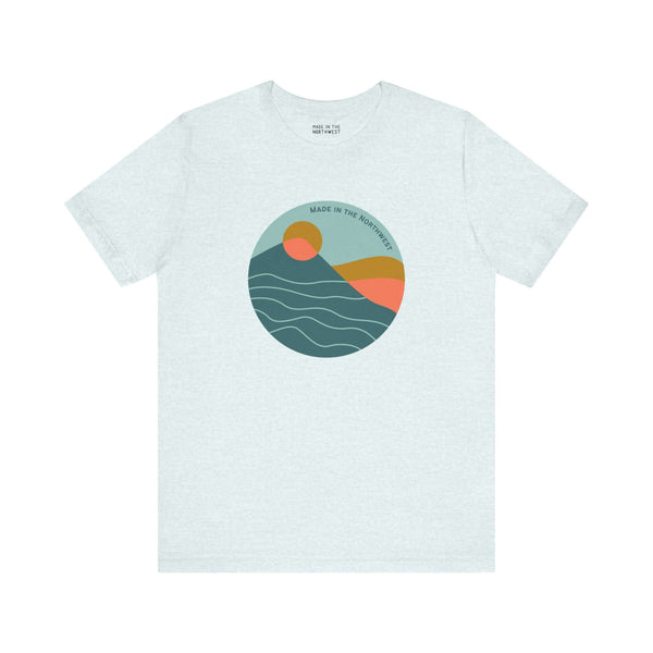 Pacific Peaks Modern Circle Soft Tee with mountain design in a circle, vibrant colors, captures Pacific Northwest style.