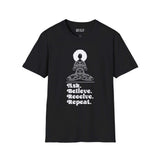 Black softstyle t-shirt featuring 'Ask Believe Receive Repeat' graphic and meditative woman design.