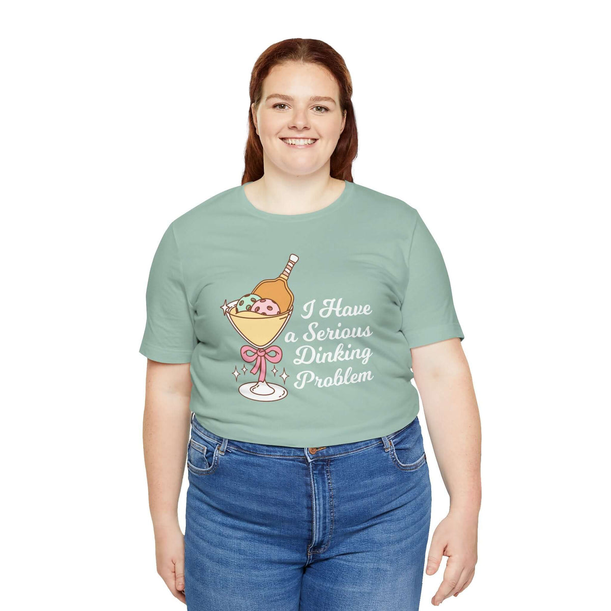 I Have a Serious Dinking Problem T Shirt worn by a smiling woman featuring a playful martini glass design.