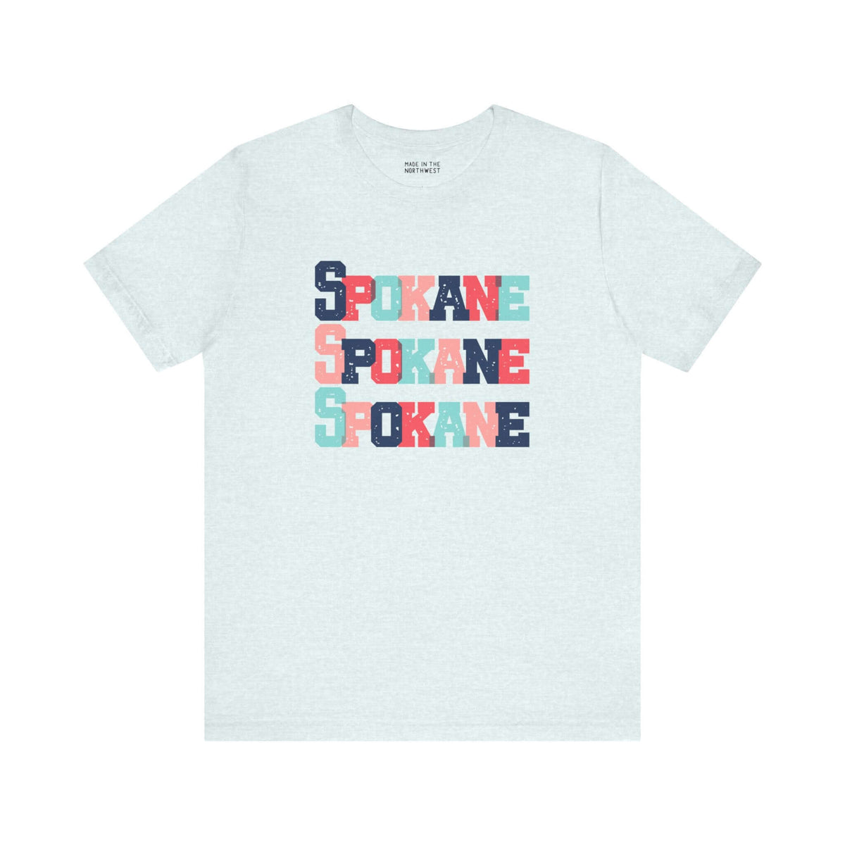 Bold and colorful Spokane trio design tee with stacked block letters on a soft fabric, perfect for Lilac City enthusiasts.