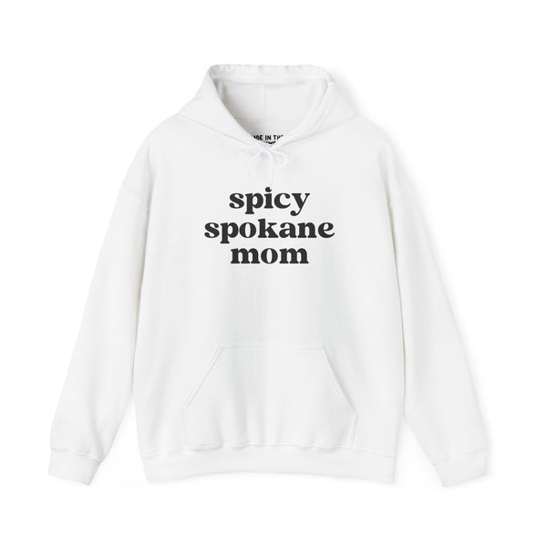 Cozy white hoodie with 'spicy spokane mom' text, perfect for active moms enjoying Spokane's outdoors.