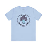 Oh Cool It's Raining Again T Shirt, featuring a playful storm cloud design on a light blue background.