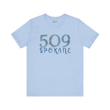 Light blue 509 Spokane floral area code soft tee for women, showcasing Pacific Northwest pride and nature-inspired elegance.