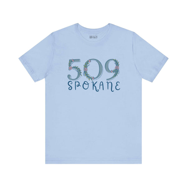 Light blue 509 Spokane floral area code soft tee for women, showcasing Pacific Northwest pride and nature-inspired elegance.