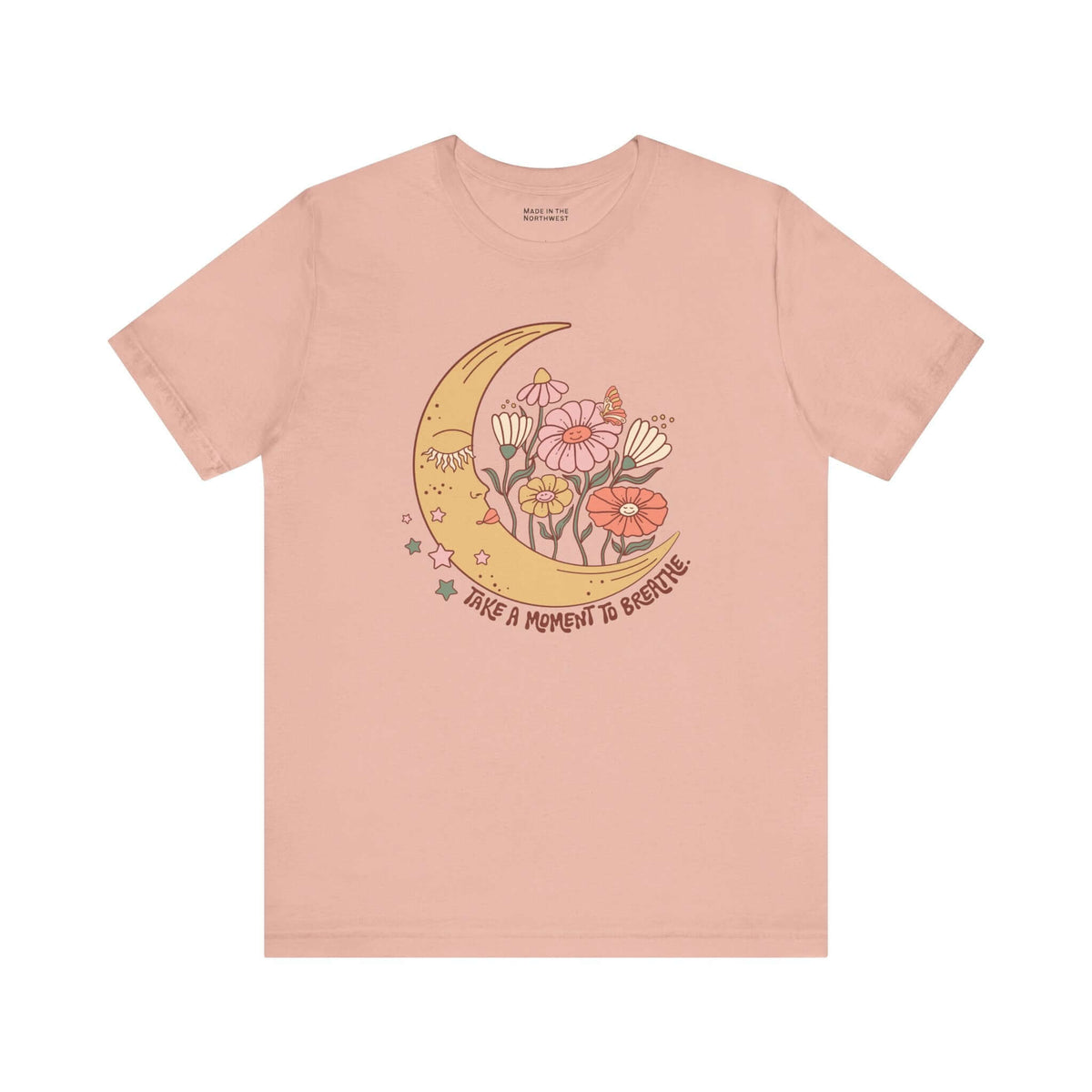 Take a Moment to Breathe T Shirt with crescent moon and wildflowers design on a soft pink tee.