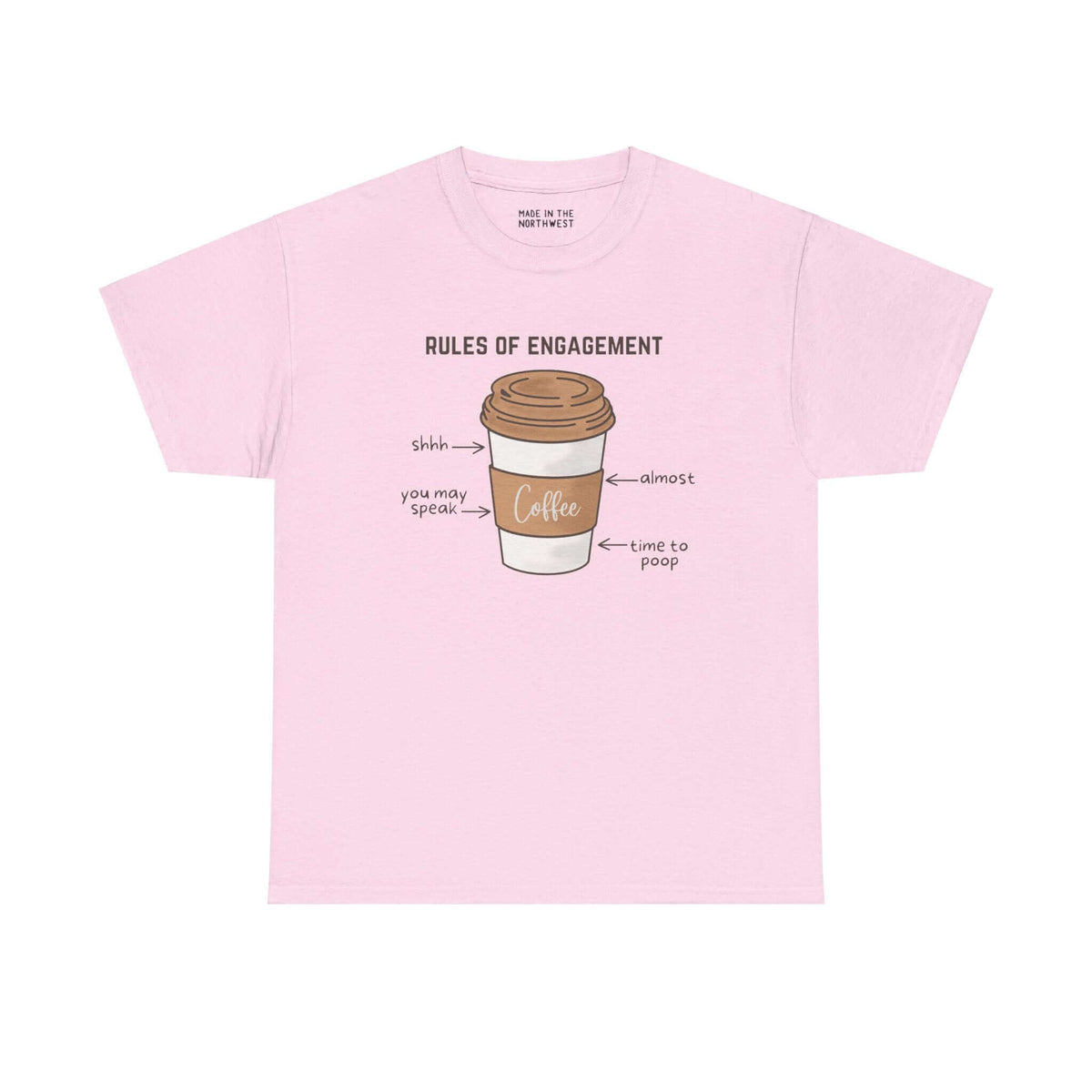 Pink athletic tee with coffee cup graphic labeled "Rules of Engagement" highlighting morning coffee etiquette in the PNW.