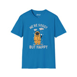 Blue t-shirt featuring a drenched cat in a raincoat with the text 'We're Soggy But Happy', perfect for Pacific Northwest lovers.