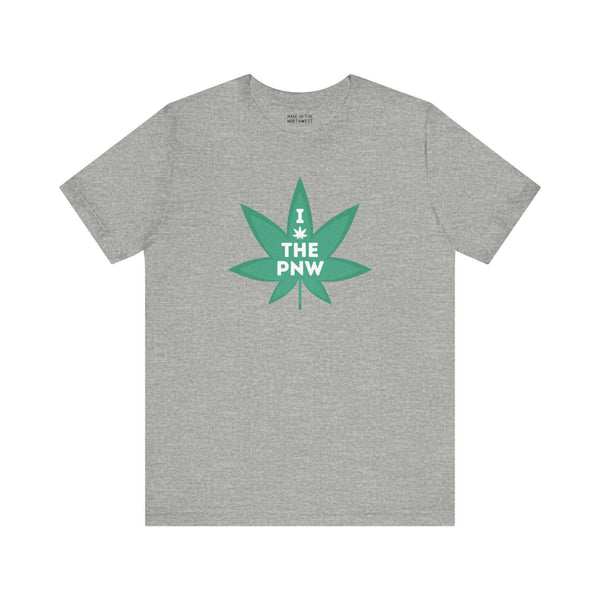 Grey T-shirt featuring "I (Weed) the PNW" with a marijuana leaf graphic, celebrating Pacific Northwest's nature-loving spirit.