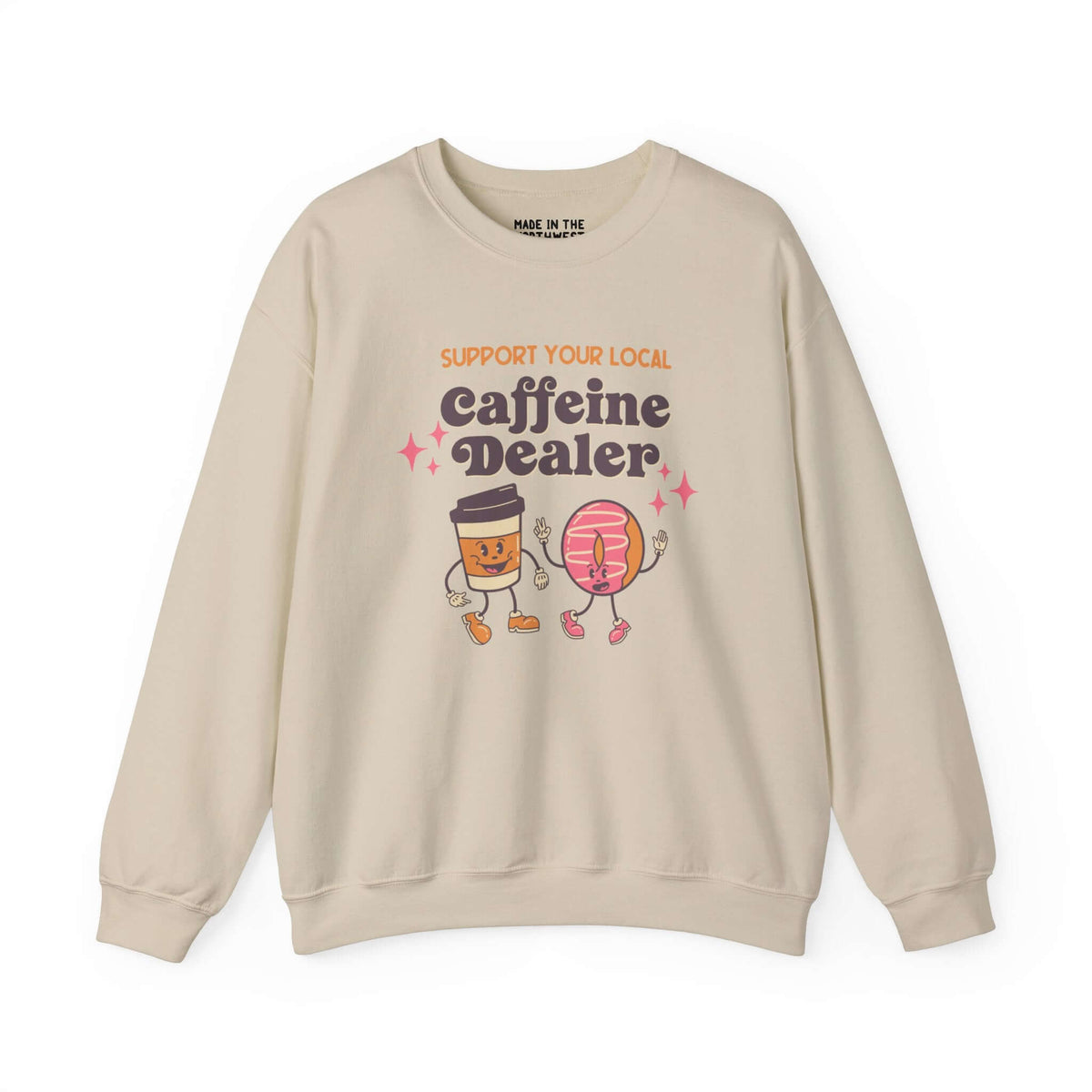 Beige sweatshirt with "Support Your Local Caffeine Dealer" design featuring playful coffee and donut cartoon characters.