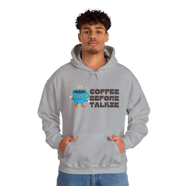 Man wearing a gray "Coffee Before Talkie" hoodie with a coffee cup graphic, perfect for coffee lovers and early risers.