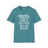 Armchair Detective T Shirt – Cozy True Crime Graphic Tee featuring a hand-drawn armchair and magnifying glass.