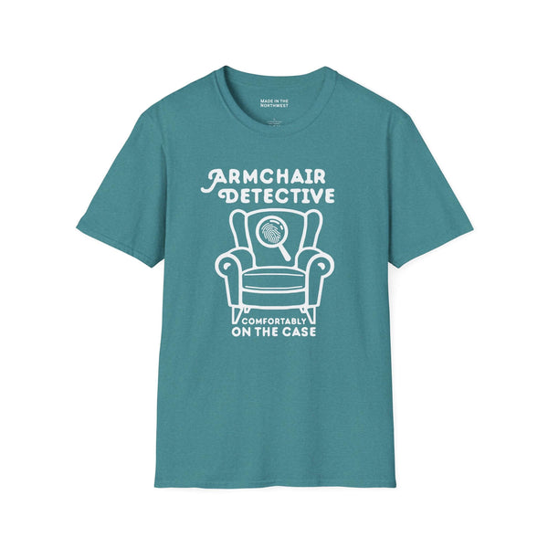 Armchair Detective T Shirt – Cozy True Crime Graphic Tee featuring a hand-drawn armchair and magnifying glass.