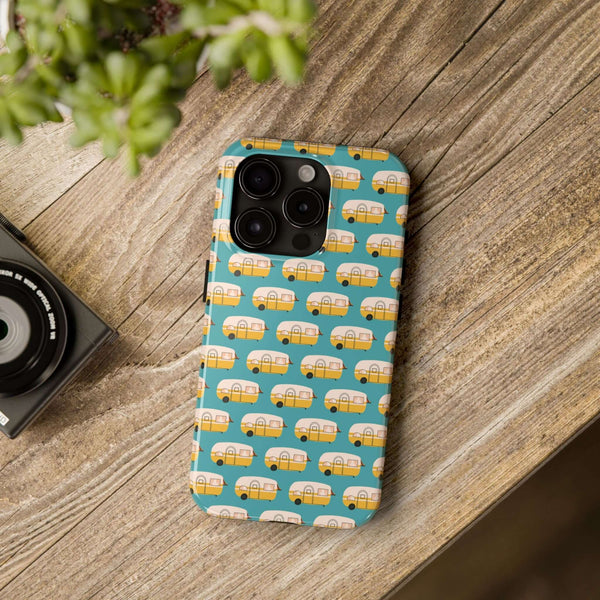 Vintage camper tough phone case design on wooden table, perfect for travel enthusiasts and adventure lovers.