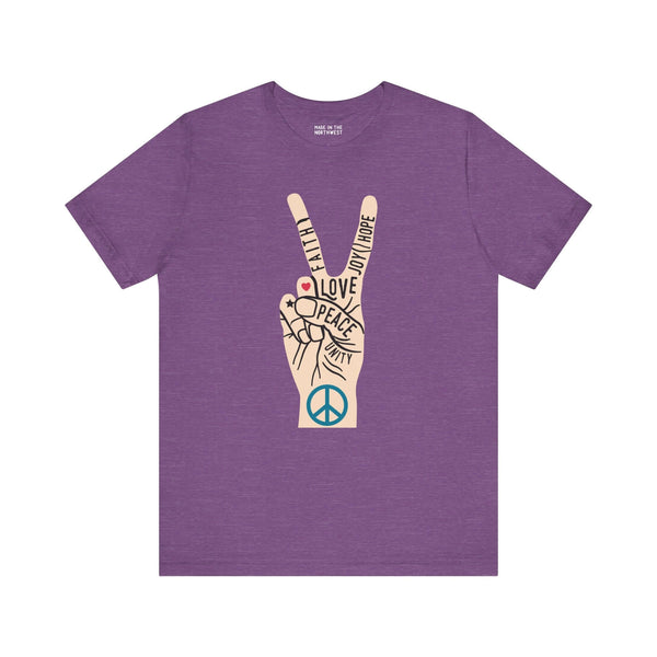 Power in Peace Premium Soft Tee featuring a hand peace sign with words of love, faith, and unity in purple.