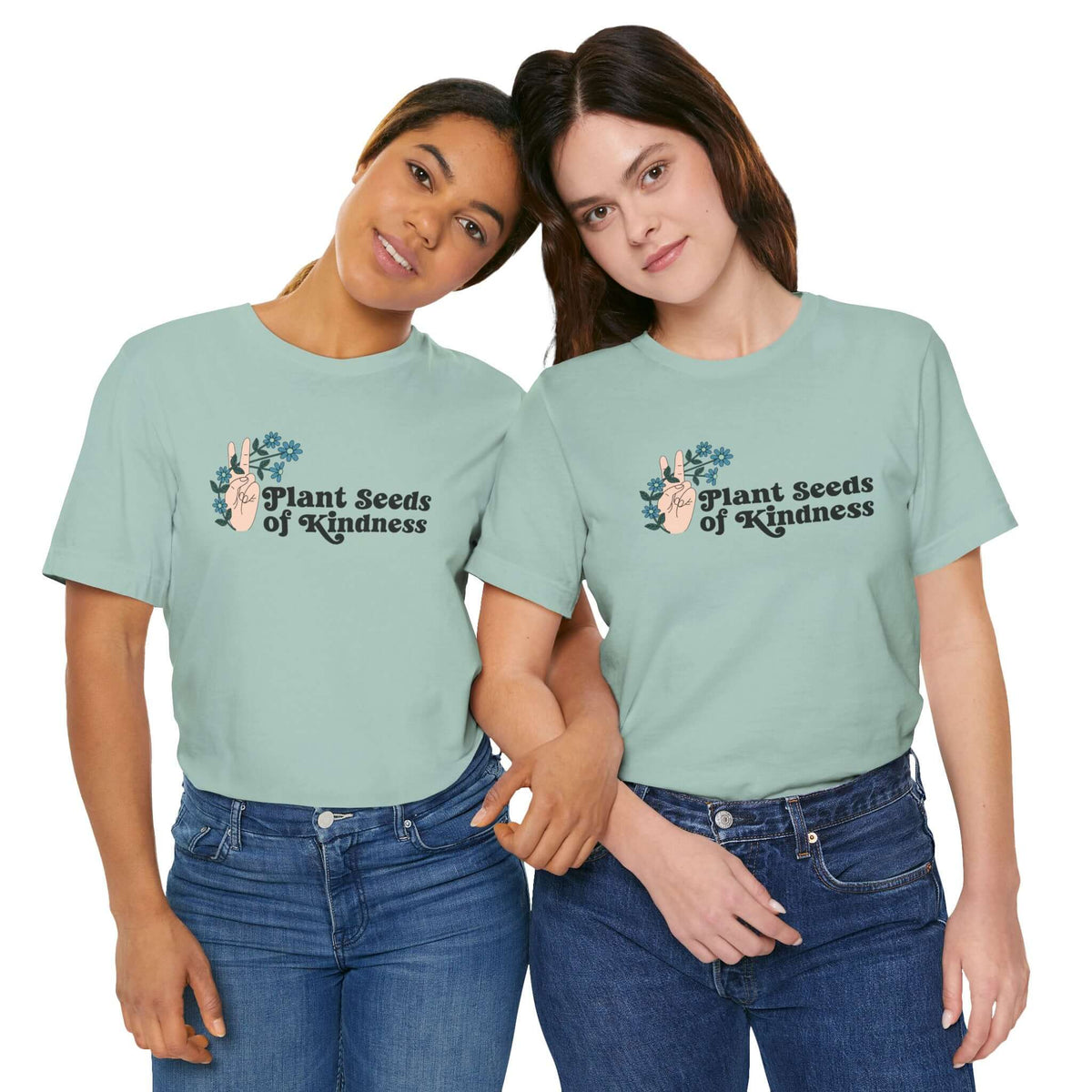 Two women wearing Plant Seeds of Kindness premium soft tees, promoting love, positivity, and a free-spirited lifestyle.