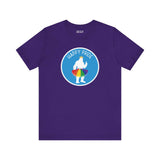 Bigfoot's Pride Parade tee featuring a white silhouette of Bigfoot with rainbow tutu and crown on a purple shirt with 