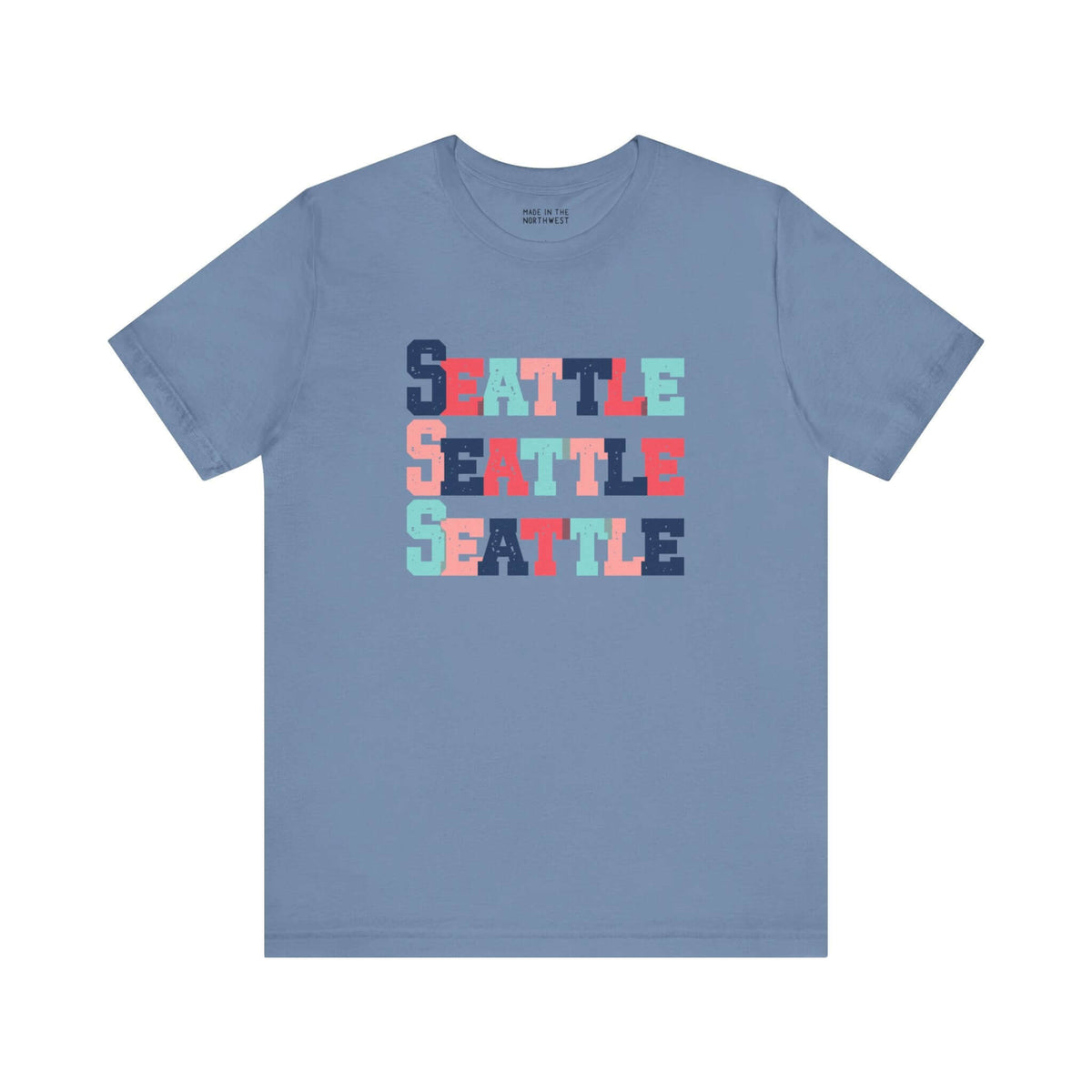 Bold and bright Seattle trio soft tee with colorful block-letter design on a blue shirt, perfect for fans of Emerald City.