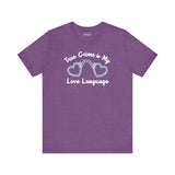True crime is my love language t shirt featuring heart-shaped handcuffs design on a purple background.
