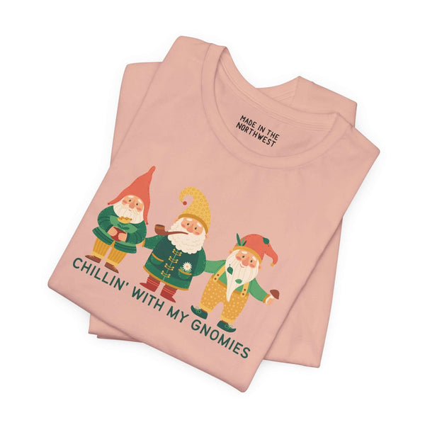 Soft pink tee featuring playful gnomes and the phrase 'Chillin' with My Gnomies', perfect for whimsical style.