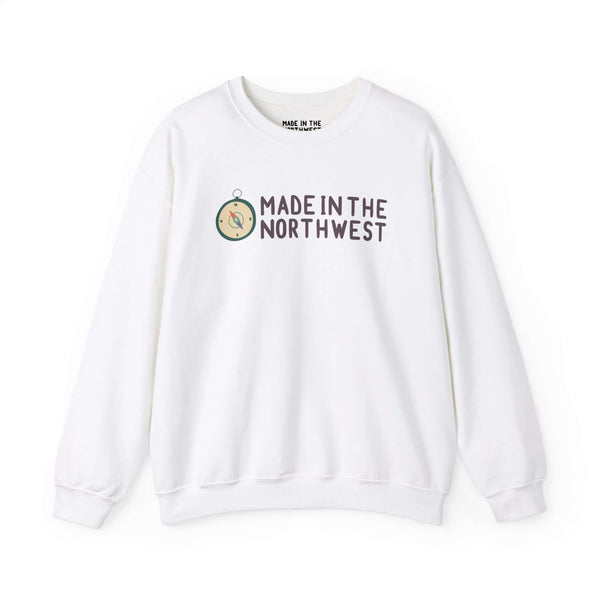 "Made in the Northwest logo sweatshirt with compass design on white fabric, showcasing Pacific Northwest pride and adventure spirit"