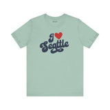 I love Seattle t shirt in light green with a cursive design showcasing love for Seattle.