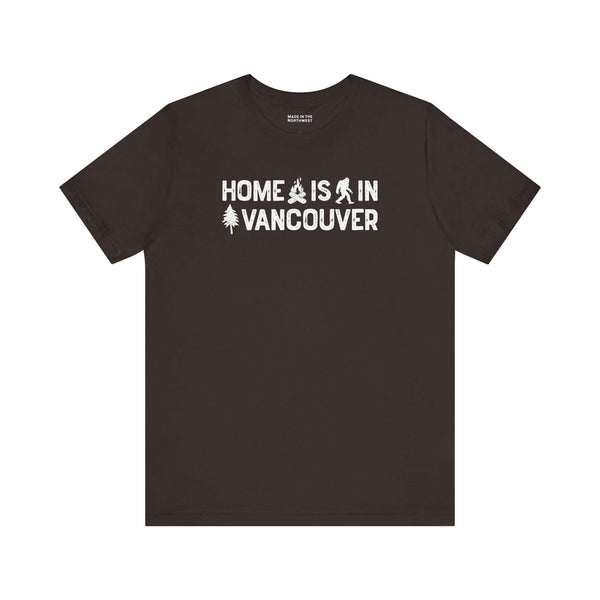 Home Is in Vancouver Tee showcasing campfire, Bigfoot, and tree designs on a black t-shirt.