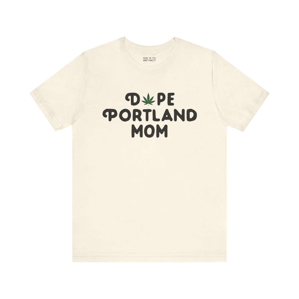 "Dope Portland Mom soft tee with marijuana leaf design on beige fabric"