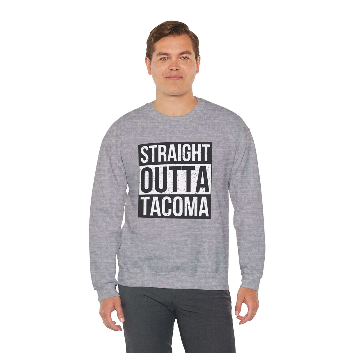 Man wearing a grey "Straight Outta Tacoma" sweatshirt showcasing local pride and streetwear style.