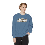 Man wearing a blue Choose Kindness sweatshirt with a vintage-inspired design.