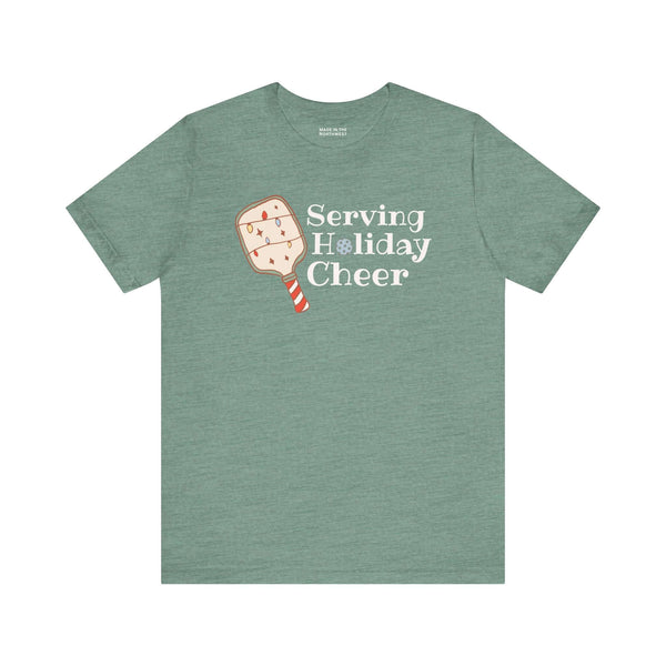 Serving Holiday Cheer Pickleball T Shirt featuring a festive paddle design and playful text.