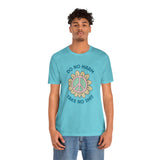 Model wearing a soft tee displaying a peace flower and the phrase 'Do No Harm, Take No Shit' in vibrant colors.