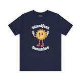 Manifest Sunshine T Shirt featuring a cheerful cartoon sun with peace signs on a navy blue tee.