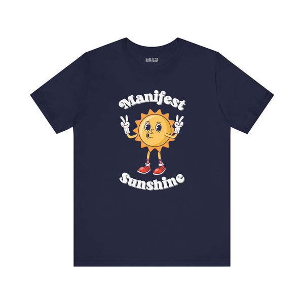 Manifest Sunshine T Shirt featuring a cheerful cartoon sun with peace signs on a navy blue tee.