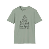 Keep Calm & Squatch On Bigfoot softstyle t-shirt in green for Sasquatch enthusiasts, featuring Bigfoot graphic.