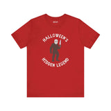 Halloween's Hidden Legend Bigfoot tee with creature holding knife on red shirt for spooky season.