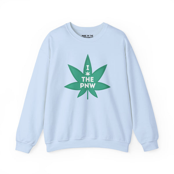 Light blue sweatshirt with bold green marijuana leaf graphic saying 'I THE PNW' for Pacific Northwest lovers.