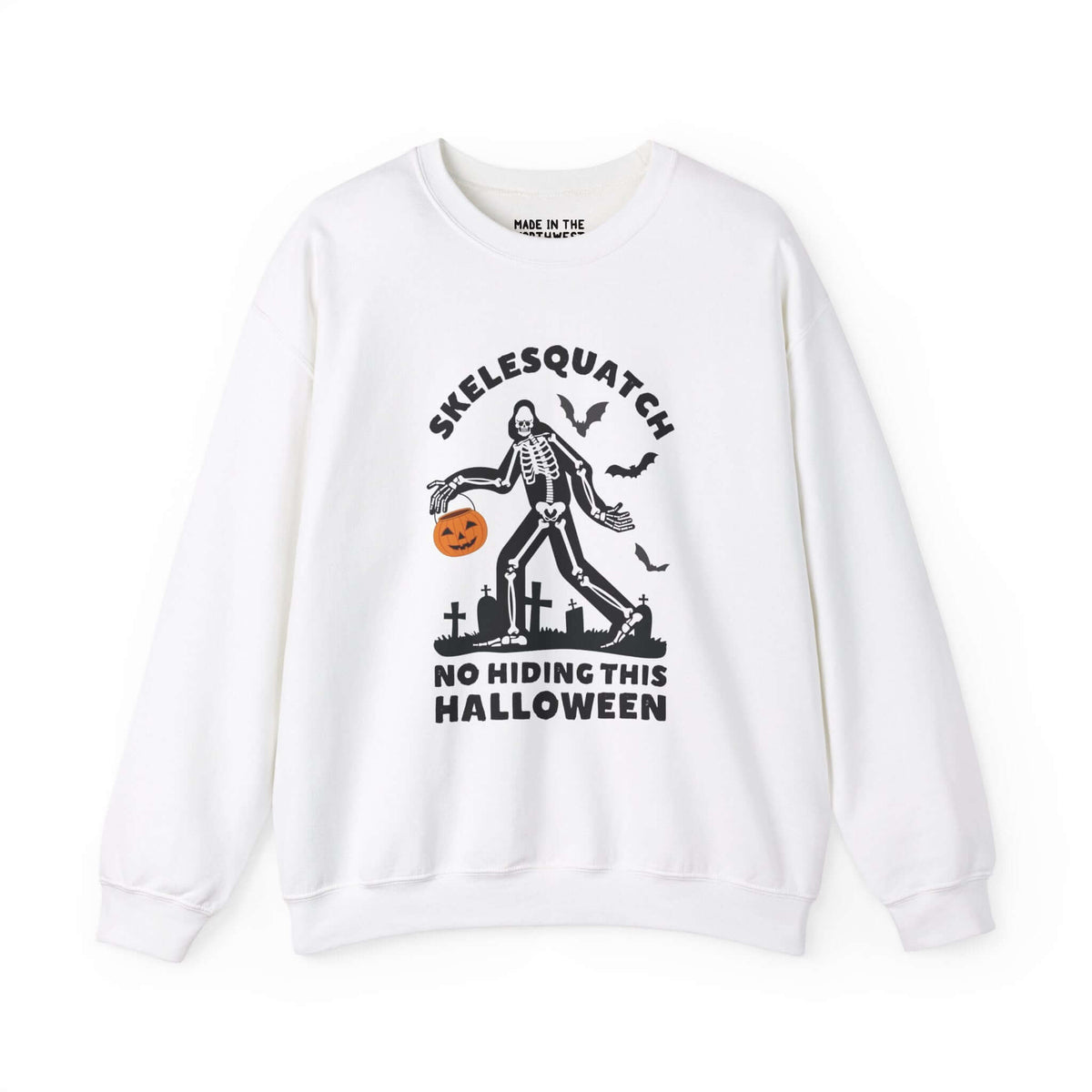 Skelesquatch Halloween sweatshirt featuring skeleton Sasquatch with trick-or-treat bucket in graveyard, perfect for spooky celebrations.