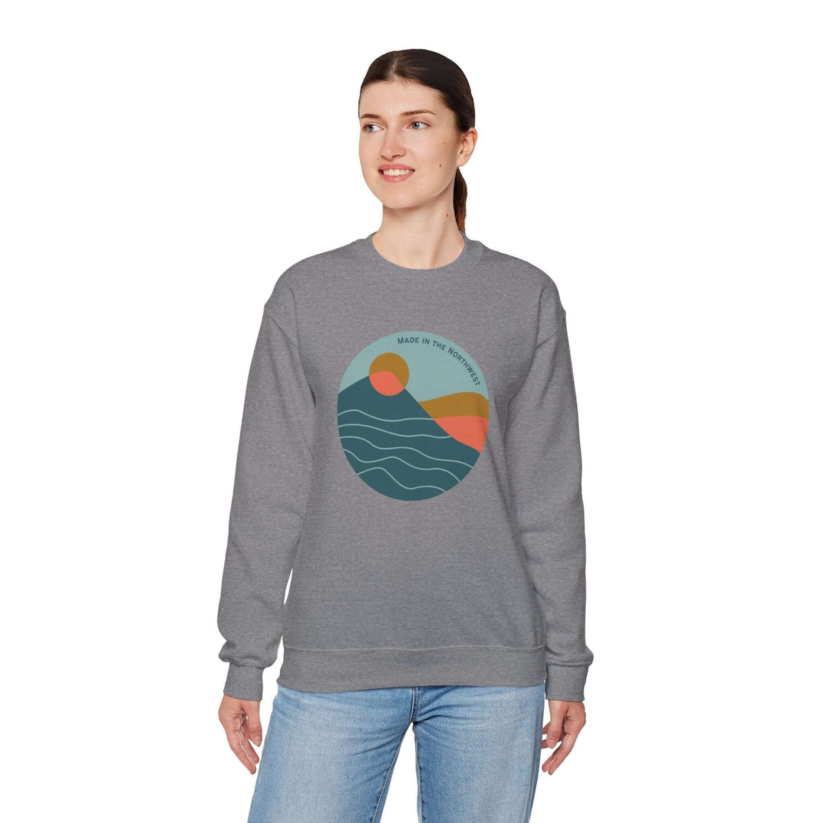 Pacific Peaks Modern Circle Sweatshirt featuring mountain scene design, worn by model in gray color, embodying Northwest style.