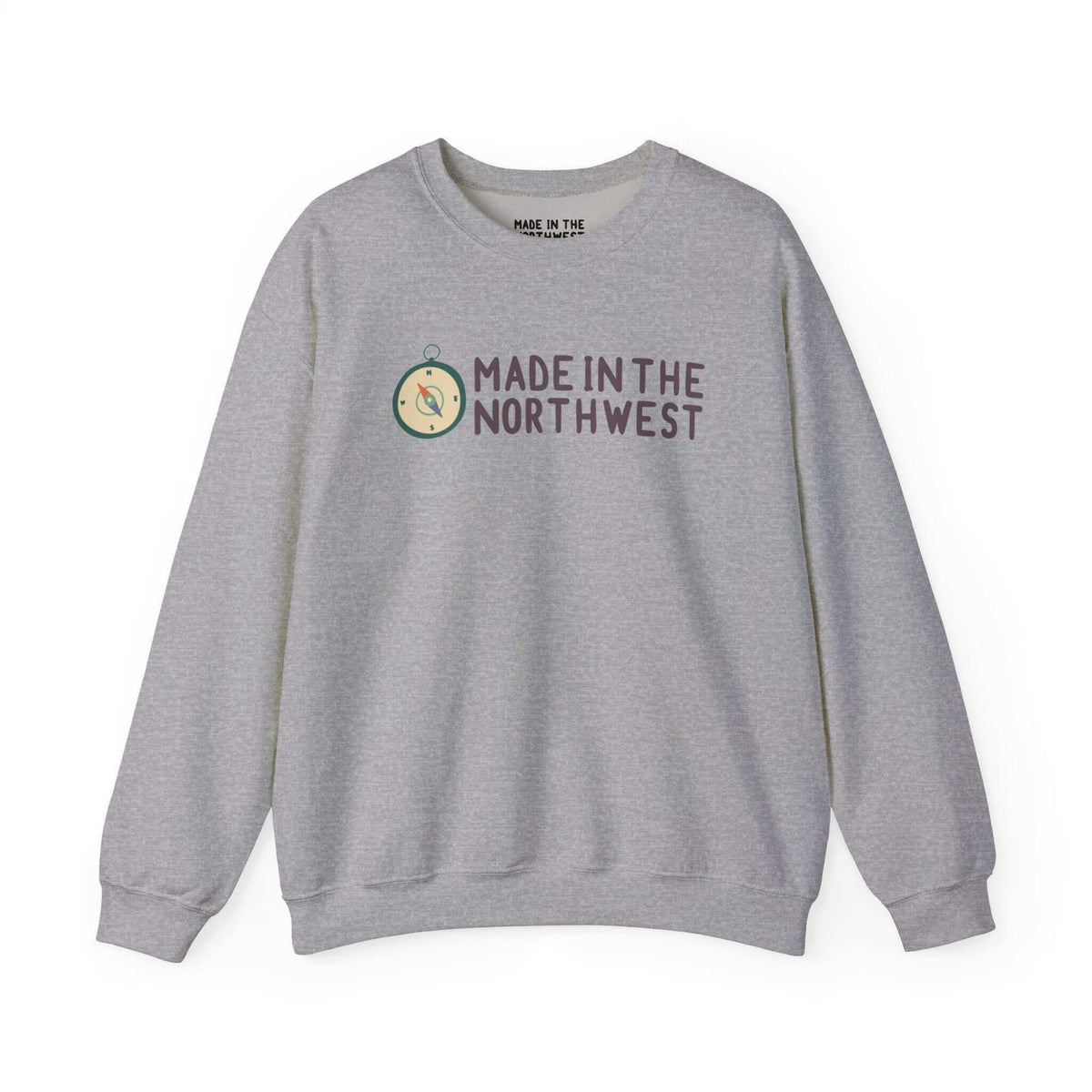 Grey sweatshirt with 'Made in the Northwest' logo and compass design, showcasing Pacific Northwest pride for adventurers and explorers.