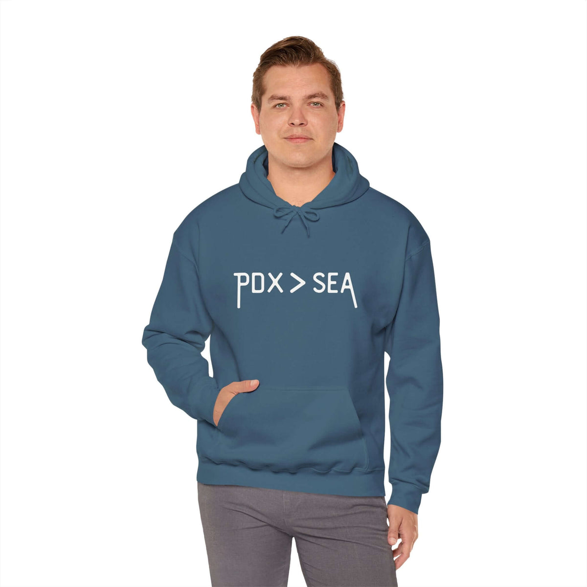 Man wearing a blue PDX > SEA hoodie, showcasing Portland pride over Seattle.