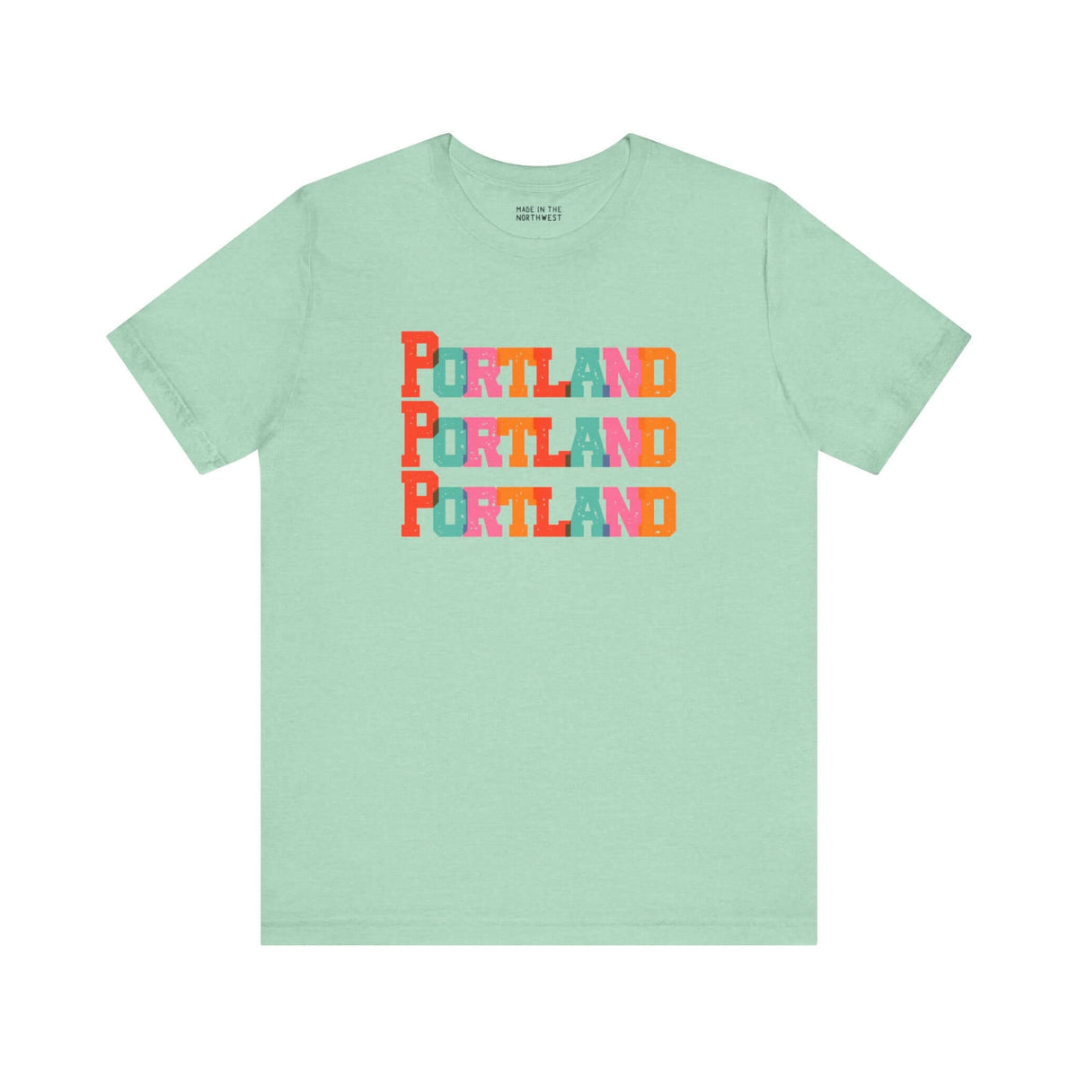 Portland trio design soft tee in mint green with bold, colorful block-letter city name, perfect for Portland locals and fans.